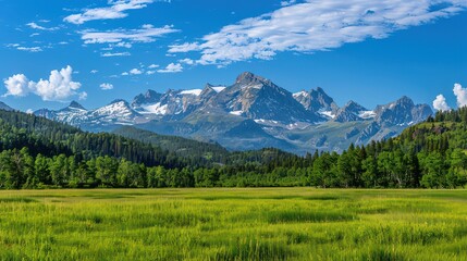 Obraz premium The photo showcases a serene view of a majestic mountain range, lush green meadows, and a clear blue sky with scattered clouds