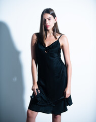 Portrait of beautiful woman with the camera. Girl photographer. Fashion photo. Portrait of a young woman taking a picture with a camera isolated over white background.