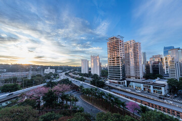 View of sunset  in Sao Paulo city, Brazil. Beggining the night in metropolis, Skyline, cars and traffic on the road