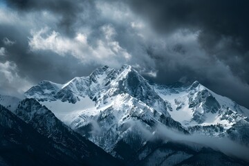 Snowy Mountain Peaks Under a Dramatic Sky