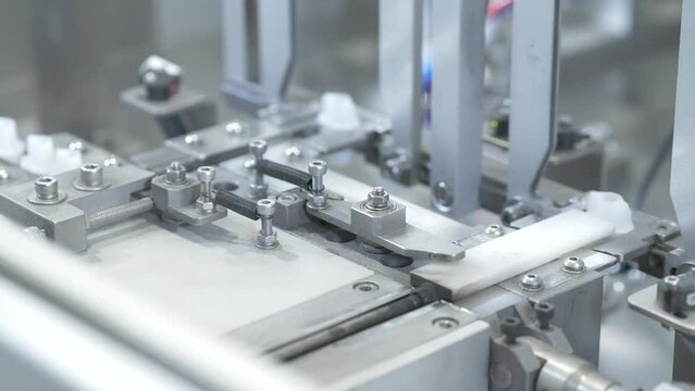industrial production of small white plastic parts