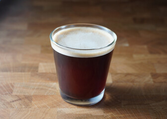 A cup of black coffee.