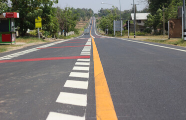 Asphalt road with traffic signs