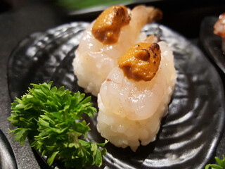 Shrimp and foie gras sushi © poom