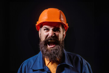 Funny bearded builder worker. Handyman builder in hardhat. Building concept. Builder foreman. Man in helmet studio portrait. Engineer worker in hardhat. Construction site manager.