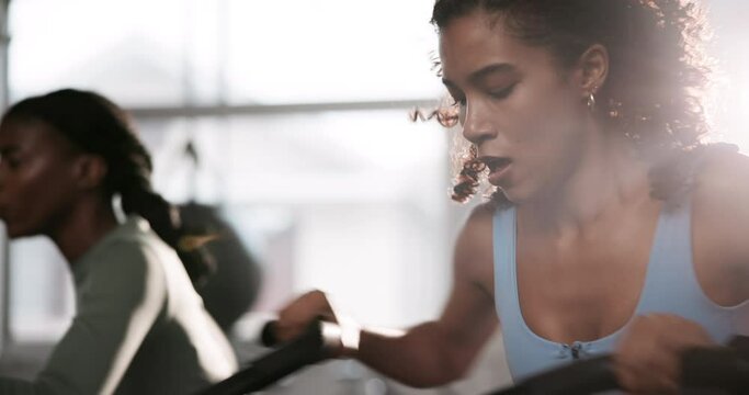 Woman, bike and exercise in gym for fitness with cardio training, endurance and wellness challenge. Athlete, person and aerobic machine or crossfit with hard work, determination and intense workout