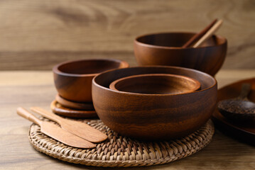 Various wooden bowl on wooden background, Kitchen utensils