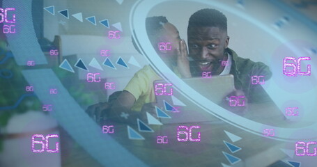 Image of scan scope over african american father and son using laptop