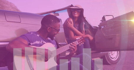 Image of audio eq meter over happy diverse couple sitting by car on roadside, man playing guitar