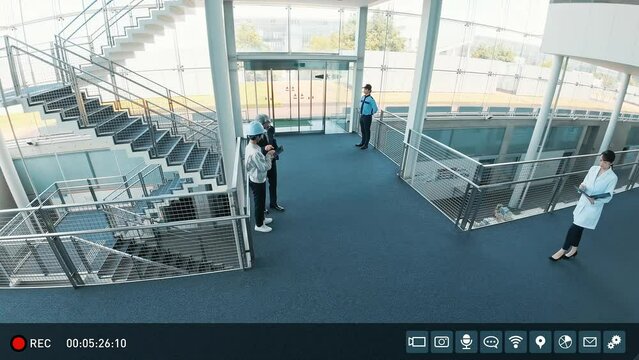 Surveillance camera footage of a building's corridor