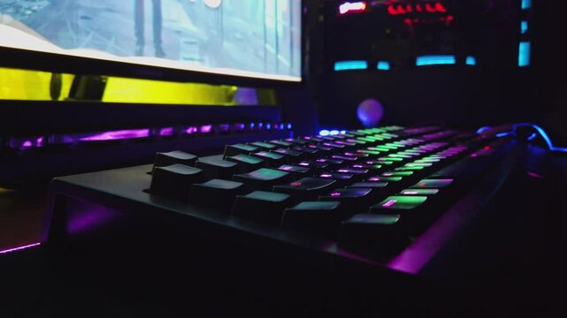 Modern Gaming PC On Desk with RGB Lights Glowing in Gamer's Dark Room