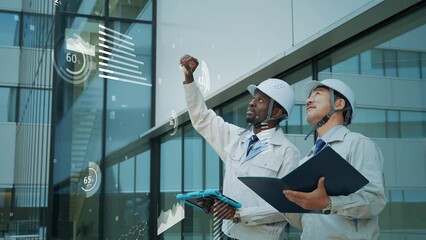 Multinational engineers having a conversation and statistics data concept - Powered by Adobe