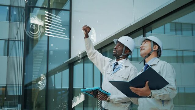 Multinational engineers having a conversation and statistics data concept