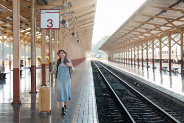 Woman with Luggage at Train Station Platform Ready for Travel Adventure, Waiting for Train Arrival,...