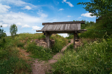 View of the Ancient city Gate in Truvorovo settlement on a sunny summer day, Izborsk, Pskov region,...