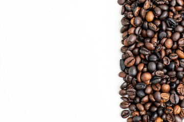 top view of pile of coffee as side border or frame on white background