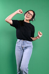 Happy Young Girl In Glasses, Sing And Dance While Listening Music From Headphones