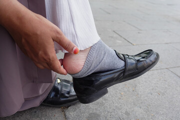 Close up on women feet and hand massage on injury spot.