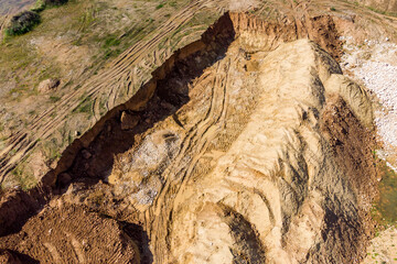 Top view of a pit dug by excavators in the ground