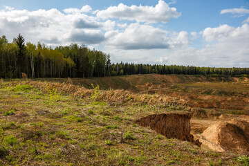 Sand and gravel quarry on the border of the forest