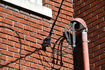 Weatherhead on brick building, electrical hookup.