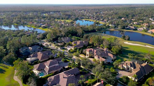 Aerial view of row of ultra luxury homes on the golf course in Lake Mary, Orlando, Florida.