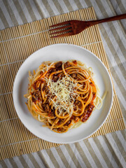 spaghetti with sauce on a white plate