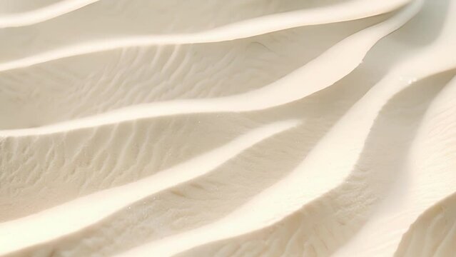The gentle curves and crevices of the sand create a soothing texture that begs to be touched.