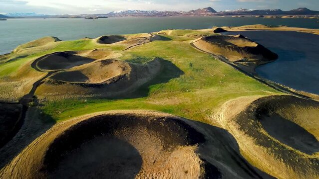 Aerial view of Skutustadagigar - many pseudo craters formed by lava flow, surrounded by Lake Myvatn wetlands