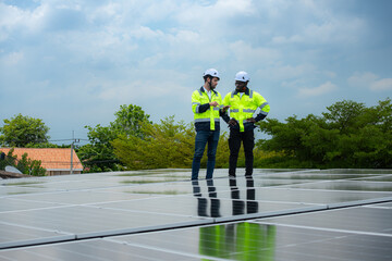 Engineer and technician inspects solar panel installation and test the operation of the panel