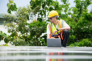 Technician inspects solar panel installation and test the operation of the panel