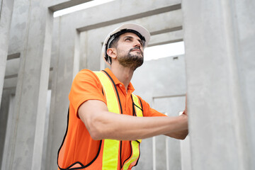 Portrait Hispanic latin engineer man checking precast cement at precast cement outdoor factory	