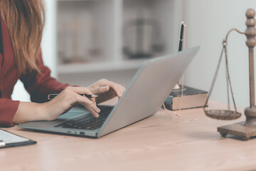 Fototapeta premium Advisory Attorney's Office justice and law Female lawyer working with scale and hammer court judge Close-up pictures