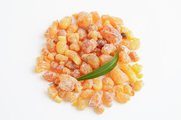 Frankincense or olibanum aromatic resin isolated on white background used in incense and perfumes.