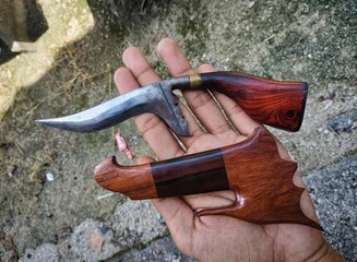 hand holding a hammer