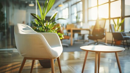 Stylish Office Waiting Area with Modern Chairs and Coffee Table, Blurred Open Workspace in Background