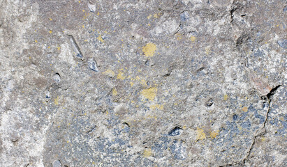 Old white wall in plaster with cracks, building texture background.