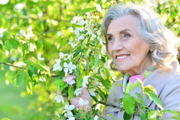 Portrait of a beautiful woman in the park in summer