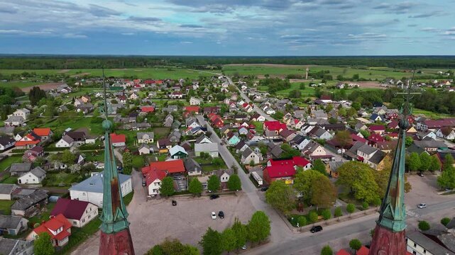 Aerial view of St. Jacob catholic church towers in the small medieval town of Silute