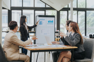 business related meeting Asian Business Team Discusses Strategy for Starting a Financial Process Analysis Project Successful Asian businessman working on a plan