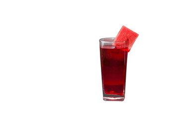 glass of watermelon juice with a melon piece placed on top
