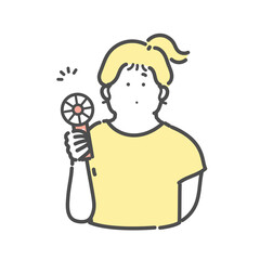 ハンディ扇風機　ハンディファンを使用する女性