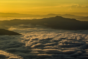 beautiful scenery Natural landscape, morning light and fog in a high mountain valley. Doi Pha Tang view point Chiang Rai Province of Thailand