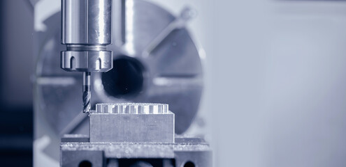 Modern CNC milling machine during operation, blue toning. Produced cutting metal parts, industry heavy factory