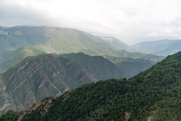 Caucasian mountain. Dagestan. Trees, rocks, mountains, view of the green mountains. Beautiful summer landscape.