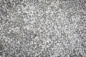 Decorative small size crushed stone for the garden, inorganic mulch as a background.