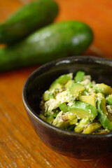 Dish of stir fried sliced avocados with egg. Vegetarian food concept. Selective focus and free copy space. Diet food. Ketogenic food menu.