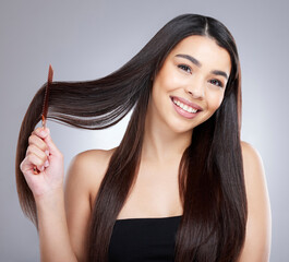 Hair care, portrait smile and woman with comb for salon aesthetic and healthy scalp for growth in...