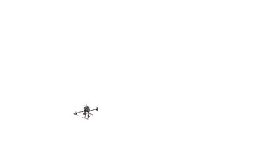 A surveillance drone over a gray sky. Space for text.
