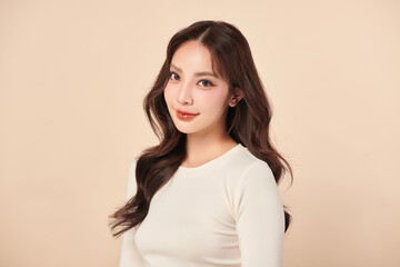 Fototapeta premium Beautiful young asian woman with clean fresh skin on beige background, Face care, Facial treatment, Cosmetology, beauty and spa, Asian women portrait.